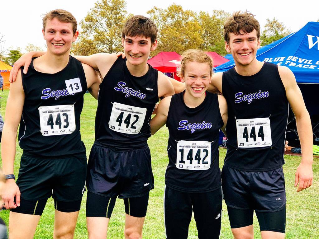 Sequims state 2A cross country competitors share smiles after completing the 5,000 meters at Sun Willows Golf Course in Pasco on Nov. 3. They include, from left, Murray Bingham, Jazen Bartee, Riley Pyeatt and Liam Byrne. Photo courtesy of Tracie Pyeatt
