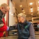 John McIntyre, a Clallam County Fire District 3 firefighter/EMT, gives a blood pressure test to Sequim community member Priscilla Hudson. Photo by Linda Barnfather