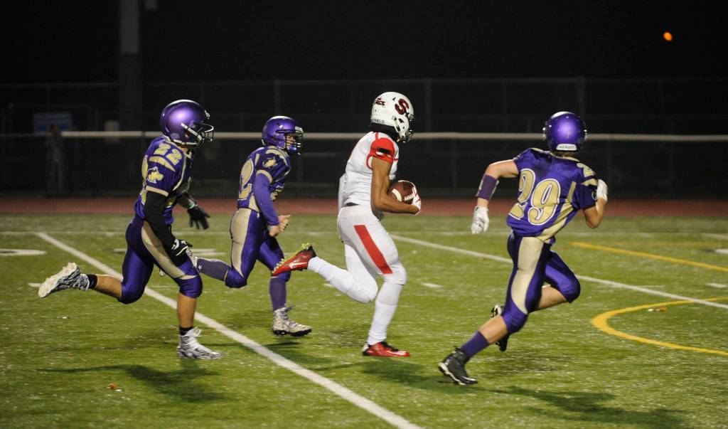 Steilacoom sophomore receiver Emeka Egbuka (2) races through the Sequim defense for one of his three first-half touchdown receptions in a 49-12 rout in Silverdale on Nov. 9. Defending the play are Wolves Walker Ward (22), Kyler Rollness (12) and Joey Oliver (29). Sequim Gazette photo by Michael Dashiell