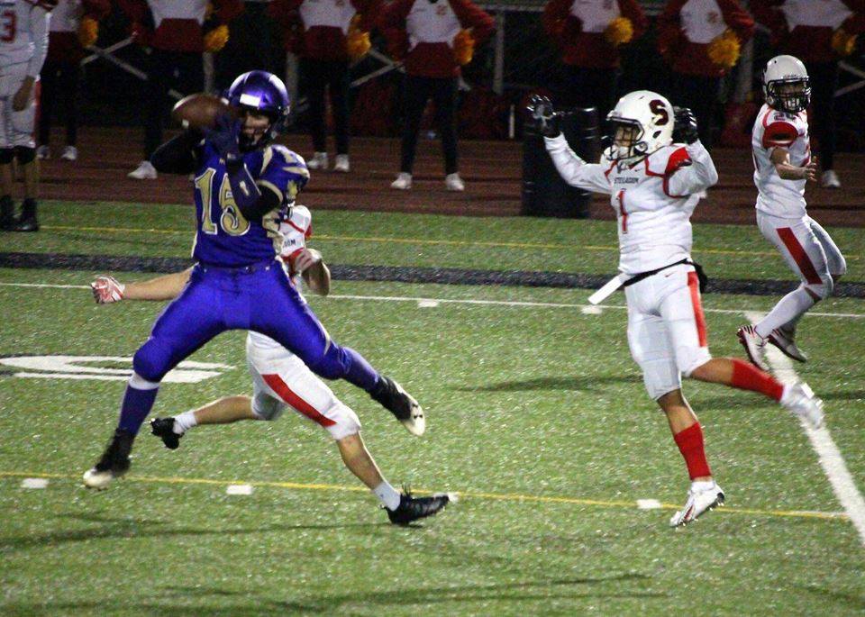 Sequim safety Taig Wiker intercepts a pass from Steilacoom quarterback J.J. Lemmings in the first quarter of the Wolves state 2A tournament game on Nov. 9. Photo by Carmen Kahulumealani Barton