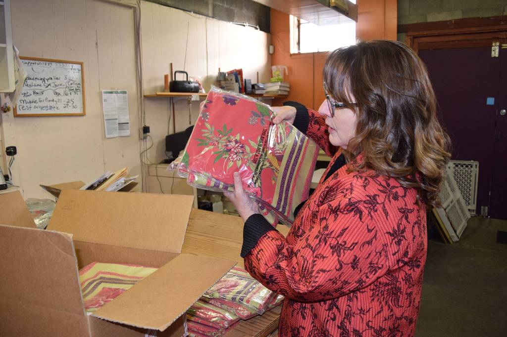 Sequims Pondicherri store offers both wholesale and retail products. Kathy Greenwald, operations manager, packs a box of product to be shipped to Neiman Marcus, one of the business bigger wholesale buyers. Sequim Gazette photo by Erin Hawkins