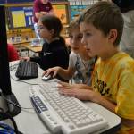 Brett Manson and Maddie Walton work on a computer together as Makaylie Albin draws during Roosevelt Elementarys Computer Club on Nov. 8. The club is a new partnership between 8-year-old student Aiden Johnson and the Sequim PC Users Group. Sequim Gazette photo by Matthew Nash