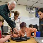 Jim Hurley with the Sequim PC Users Group shows Roosevelt Elementary students, from left, Zephyr Thompson, Maddie Walton, Aiden Johnson, and Andre Campbell the inner-workings of a laptop during the schools Computer Club on Nov. 8. Sequim Gazette photos by Matthew Nash