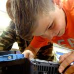 Quentin Bennett works to rebuild a computer in October during Roosevelt Elementarys Computer Club presented by the Sequim PC Users Group. Photo courtesy of Dick Wolf