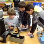 Zephyr Thompson, Aiden Johnson and Andre Campbell work together to rebuild a computer during Roosevelt Elementarys Computer Club. Photo courtesy of Dick Wolf