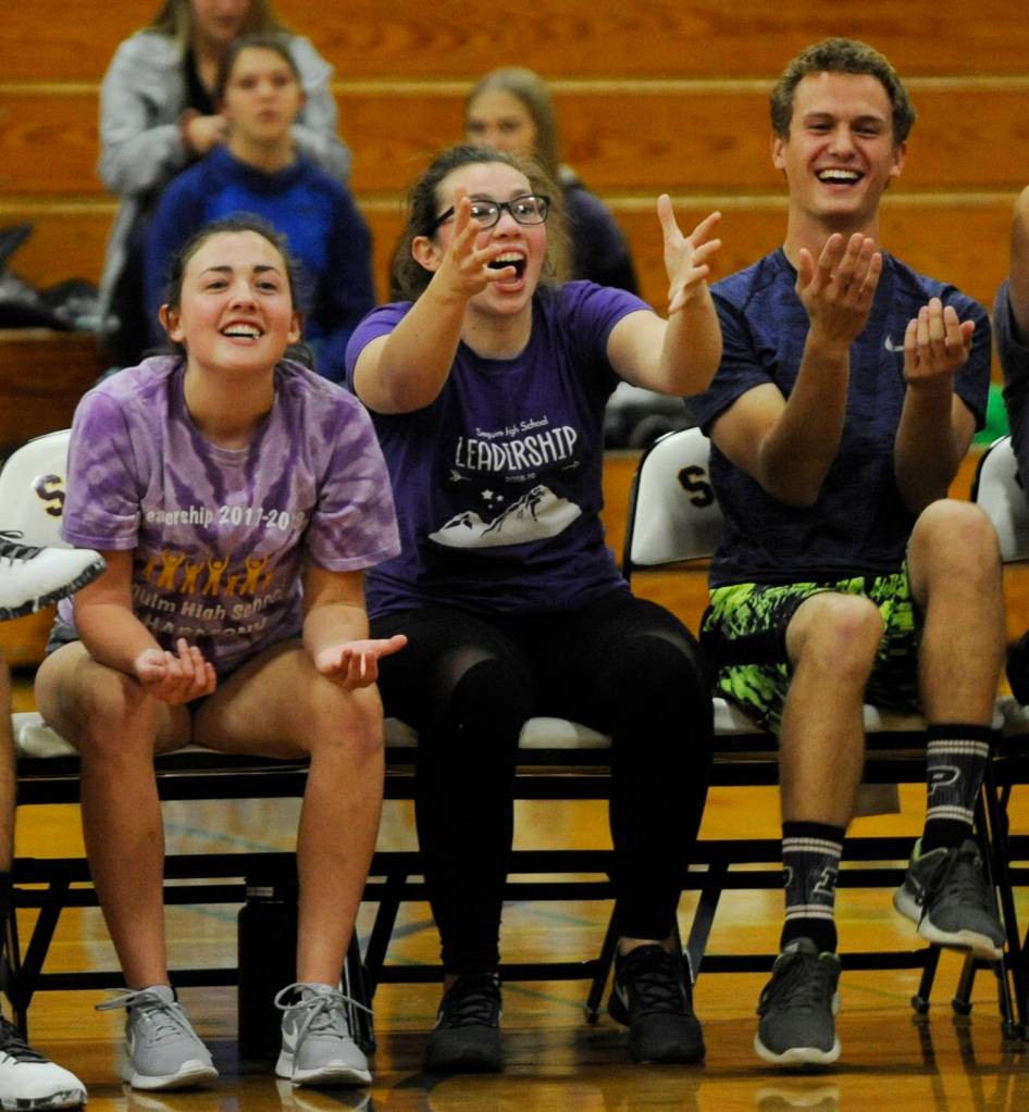 Sequim High seniors (from left) Ashley Rosales, Maggie VanDyken and Liam Payne offer a critique to their teammates during last weeks rivalry game against the SHS staff. Sequim Gazette photo by Michael Dashiell