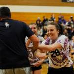 Sequim High seniors Tayler Breckenridge, right and Brittany Gale share a laugh with Shawn Langston after the SHS principal blocked a seniors hit at last weeks Seniors-Versus-Staff game. Sequim Gazette photo by Michael Dashiell