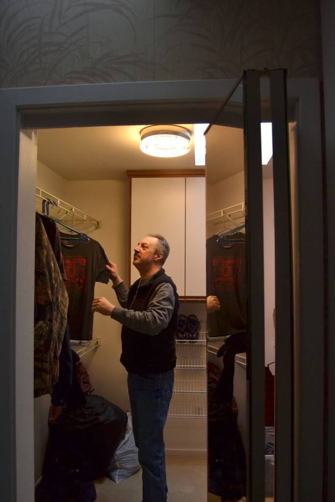 Jim Wasnock, a resident of Oxford House Rainshadow, shows off the amenities in the Sequim home including a walk-in closet for two of his housemates. The home houses six men working together on recovery from substance abuse. Sequim Gazette photo by Matthew Nash