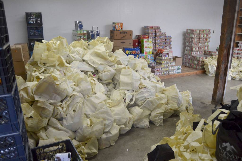 In about 30 minutes, church and community volunteers filled 900 bags of stuffing and various fixings for community members at the Sequim Food Bank on Nov. 13. Sequim Gazette photo by Matthew Nash