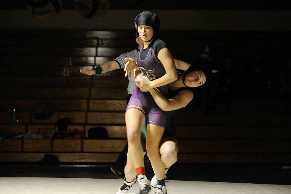 Sequims Amara Sayer avoids a takedown by Klahowyas Hannah Bumbalough in a December 2017 league meet. Sayer is one of the Wolves more experienced returning grapplers this season after amassing 15 wins in 2017-2018.