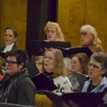 Kyra Humphrey, center, sings along with 64 others in the Sequim Community Christmas Chorus this weekend in three shows Nov. 30, and Dec. 1-2, at the Sequim Seventh-day Adventist Church. Sequim Gazette photo by Matthew Nash