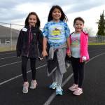 Helen Haller Elementary students Addison Carver, Johonna Chavez and Aubri Miller round a corner all smiles at the schools Turkey Trot on Nov. 21.