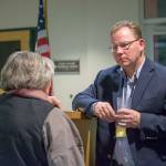 State Superintendent of Public Instruction Chris Reykdal talks with Port Angeles School Board Director Sandy Long on Monday. (Jesse Major/Peninsula Daily News)