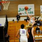 Sequims Abby Shroeder drives through the Coupeville defense for a finger-roll layup in the first half of her teams 54-25 win on Dec. 3. Looking on is Sequim teammate Jayla Julmist. Sequim Gazette photo by Michael Dashiell