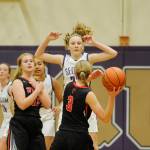 Sequims Melissa Porter pressures Coupevilles Chelsea Prescott in the first half of a Dec. 3 non-league game in Sequim. Sequim Gazette photo by Michael Dashiell