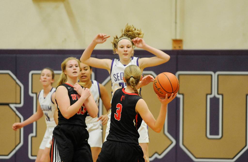 Sequims Melissa Porter pressures Coupevilles Chelsea Prescott in the first half of a Dec. 3 non-league game in Sequim. Sequim Gazette photo by Michael Dashiell