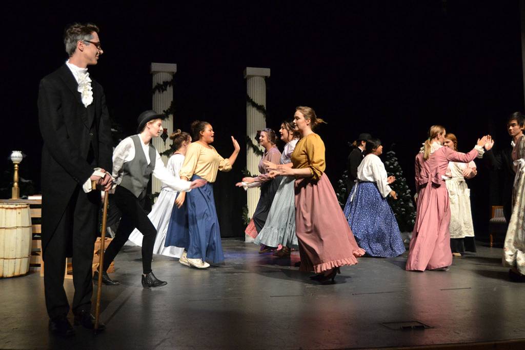 Ebenezer Scrooge watches a happy memory from his past as hes visited by the Ghost of Christmas Past. A Christmas Carol runs Dec. 7-8 and 14-15 at Sequim High School. Sequim Gazette photo by Matthew Nash