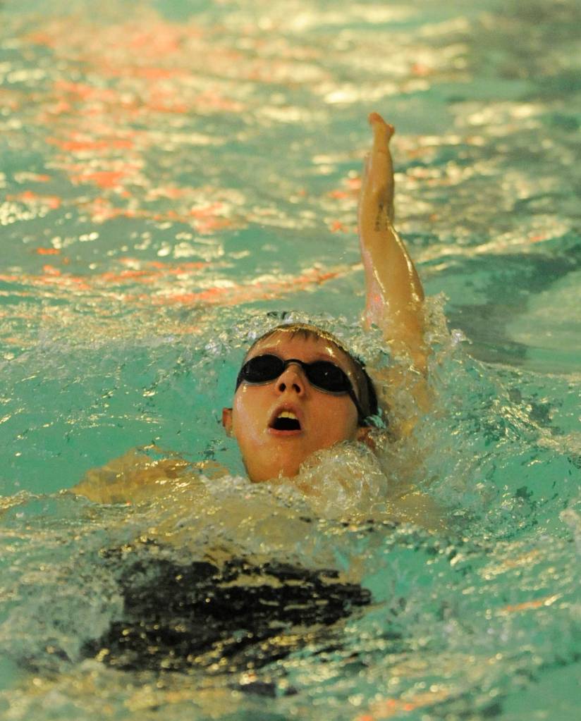 Sequims Blake Boardman swims the 100 backstroke portion of the 200 medley relay at Port Angeles on Dec. 13. Sequim Gazette photo by Michael Dashiell