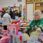 Donna Wade sorts butterfly wings while waiting to help Sequim residents pick out toys for their children on Dec. 12. Sequim Community Aid has continued Toys for Sequim Kids for 70-plus years. Sequim Gazette photo by Matthew Nash