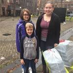 River Jensen, left, started sharing toiletry gift bags on Dec. 15 with help from her brother Canyon and cousin Grace in Seattles Pioneer Square. Its the third year shes collected and donated gift bags to homeless and at-risk individuals in Seattle and on the Olympic Peninsula. Photo courtesy of Dana Jensen