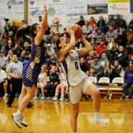 Sequims Hope Glasser, right, drives past North Kitsaps Noelani Barreith in the second half of the Wolves 61-53 home loss on Dec. 18. Glasser had 14 points in the Wolves first defeat of the season. Sequim Gazette photo by Michael Dashiell