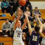 Sequims Kalli Wiker (21) puts up a shot over North Kitsap forward Grace Johnson in the second half of the Wolves 61-53 loss on Dec. 18. Wiker led Sequim with 17 points. Sequim Gazette photo by Michael Dashiell