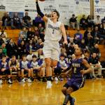 Sequim guard Nate Despain, left, drives in for two of his team-high 20 points in a Dec. 18 Olympic League match-up against North Kitsap. NK won, 70-55. Sequim Gazette photo by Michael Dashiell
