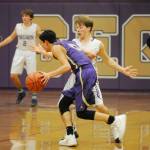 Sequim guard Kyler Rollness pressures North Kitsap guard Johny Olmsted in the first half of NKs 70-55 win in Sequim on Dec. 18. Rollness had 13 points in the loss. Sequim Gazette photo by Michael Dashiell