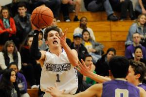 Boys basketball: Vikings wear down Wolves for league lead