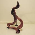 Continual Motion was given to the Dalai Lama as a gift from Washington state leaders during a recent trip to India. Artist Tuttie Peetz made it from western red cedar wood she found in a clear cut south of Forks. It is the first driftwood piece she placed an inlay metal strip (crushed copper). Photo courtesy of Tuttie Peetz