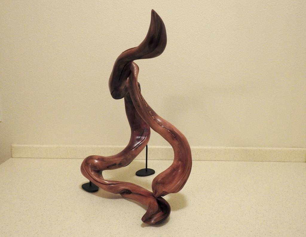 Continual Motion was given to the Dalai Lama as a gift from Washington state leaders during a recent trip to India. Artist Tuttie Peetz made it from western red cedar wood she found in a clear cut south of Forks. It is the first driftwood piece she placed an inlay metal strip (crushed copper). Photo courtesy of Tuttie Peetz