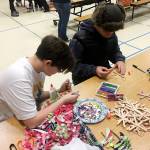 Faith Amaya and Abram Yeater work on craft projects at the 2019 Olympic Peninsula Academy Winter Fest in mid-December. Submitted photo