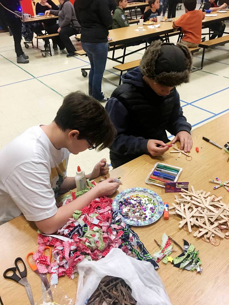 Faith Amaya and Abram Yeater work on craft projects at the 2019 Olympic Peninsula Academy Winter Fest in mid-December. Submitted photo
