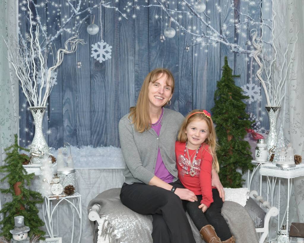 Greywolf student Olianna Brailey and mom Karlena enjoy a special evening event focused on Kids at Hope on Dec. 11. Photo by Marilyn Westman