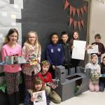 Students in Caryn Littles classes at Greywolf Elementary School show off their Middle Ages-inspired projects. They include (back row, from left): Kayhbree Henderson, with a cardboard/toilet paper rolls castle; Sariah Weller, with a LEGO castle; Myles Taylor, with a cardboard/duct tape castle; Elijah Chavez, with a LEGO castle; Lily Sparks, with an informational poster and flashcards, and Aidan Danielson, with a LEGO castle, with (front row, from left) Maisy French, with a cabbage pottage recipe; Stanley Baker, with a catapult; Kaitlyn Carpenter, with a LEGO castle (with help from classmate Areya Webb), and Lauren Cline, with a pottage recipe poster board. Photo by Darcy Lamb