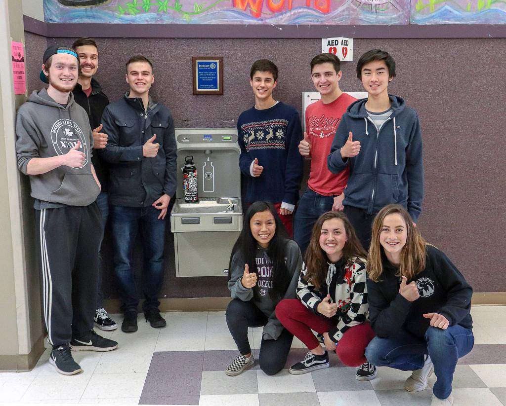 Sequim High Interact Club officers congregate near the schools new water bottle-filling station. They include (back row, from left) Devin Hibler, Liam Stevenson, Mathew Craig, Sean Weber, Brenden Jack and Raymond Lam, with (front row, from left) Kristina Mingoy, Ashley Rosales and Isabelle Hugoniot. Submitted photo