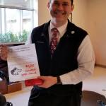 First place winner Jason Wilwert receives his $100 Costco gift card. Submitted photo