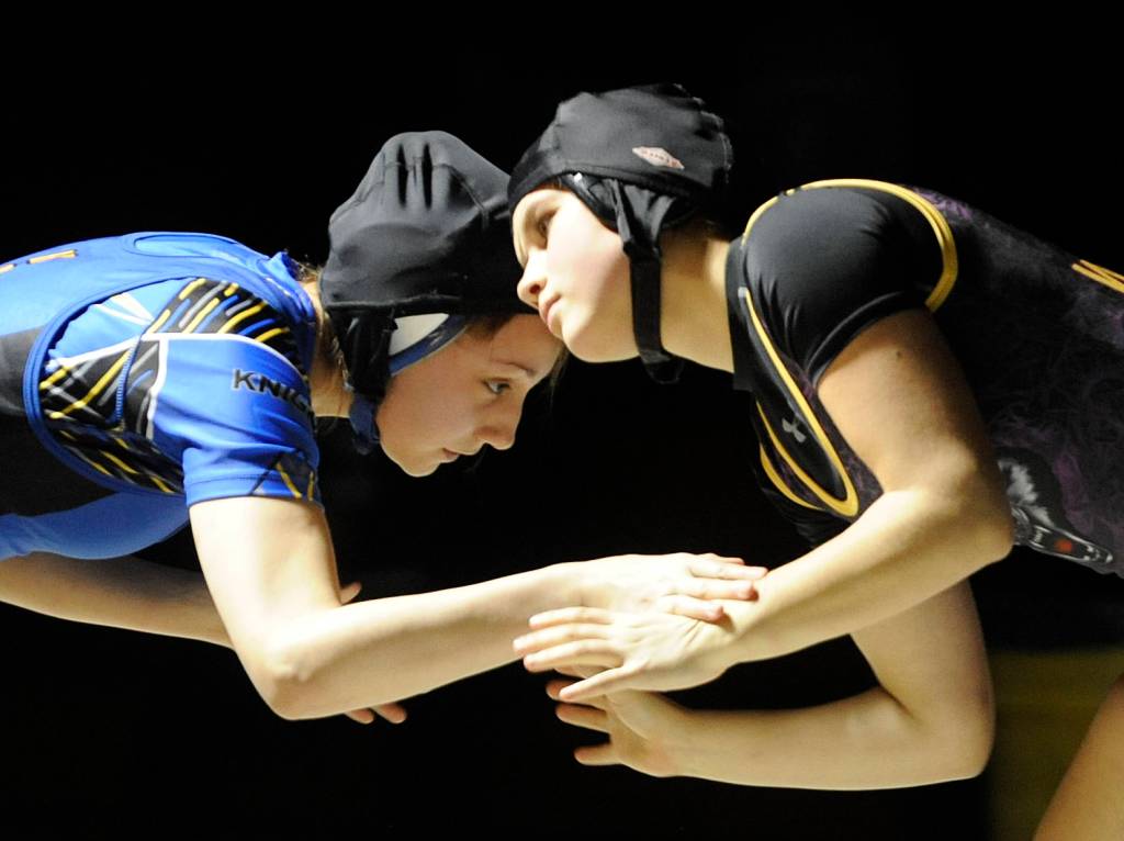 Sequims Alexi Rampp-Taft grapples with Bremertons Jenna Adams in the 125-pound weight class at a dual meet in Sequim on Dec. 12. Rampp-Taft won by pin. Sequim Gazette photo by Michael Dashiell