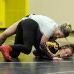 Kaydence Hilliard, bottom, gets some practice time with volunteer coach Jilian Hutchison-Blouin, a 2018 Sequim High graduate. Sequim Gazette photo by Michael Dashiell