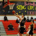 Sequim guard Michael Young gets fouled by Ferndales Brady Morrison in the first half of a Dec. 28 non-league match-up in Port Townsend. Sequim Gazette photo by Michael Dashiell