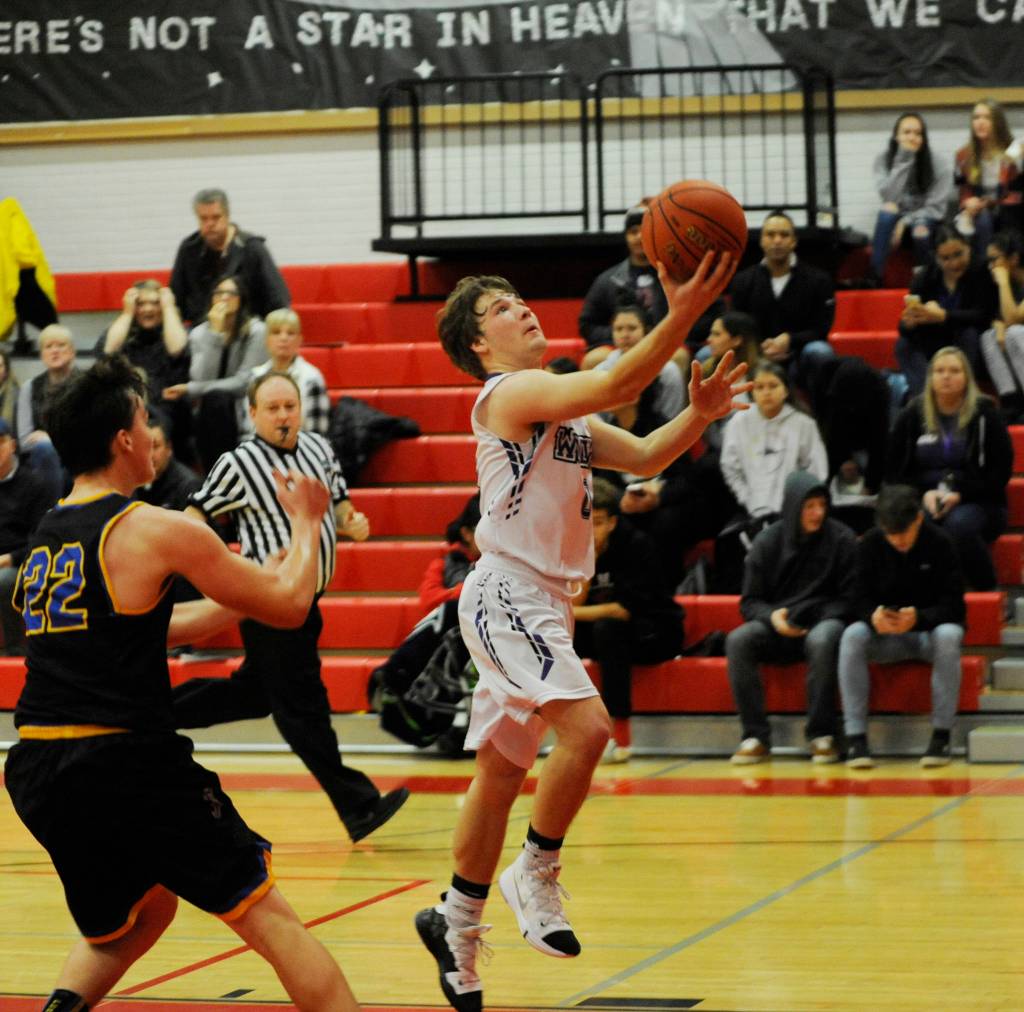 Sequim guard Kyler Rollness drives to the basket in the second half of a win against Ferndale on Dec. 28 in Port Townsend. Rollness finished with 11 points. Sequim Gazette photo by Michael Dashiell