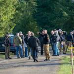 Investigators are seen Tuesday at a property on Bear Meadow Road near Port Angeles where three bodies have been found. (Jesse Major/Peninsula Daily News)