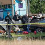 Investigators search through a property on Bear Meadow Road where three bodies have been found. (Jesse Major/Peninsula Daily News)