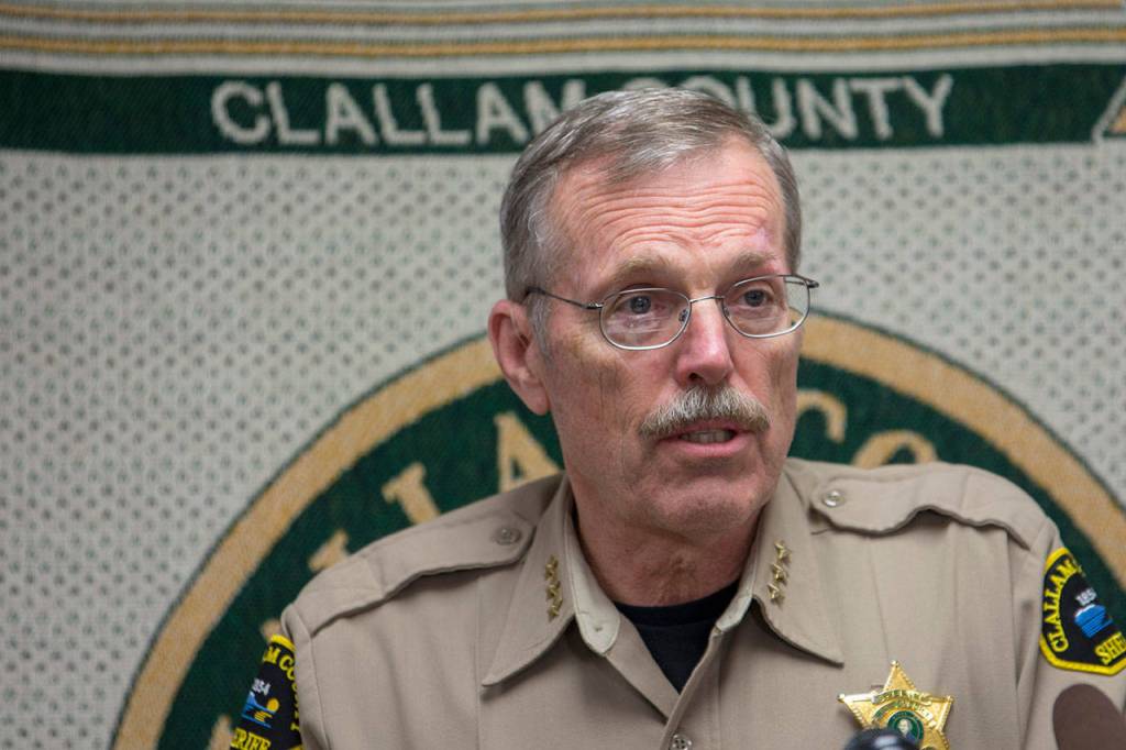 Clallam County Sheriff Bill Benedict answers questions about the triple homicide near Port Angeles during a press conference Tuesday. (Jesse Major/Peninsula Daily News)