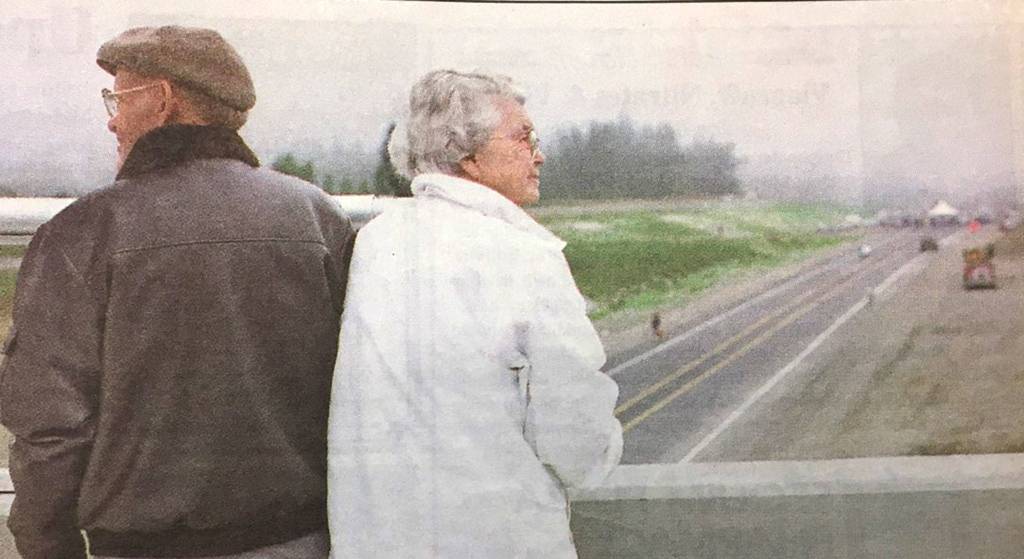 Gerry and Dorothy Brown of Sequim look down on the new Sequim bypass from the River Road bridge on Aug. 18, 1999, to see the opening of the new roadway. Down the highway, the Simdars Road Interchange remains unfinished nearly 20 years later. Sequim Gazette file photo