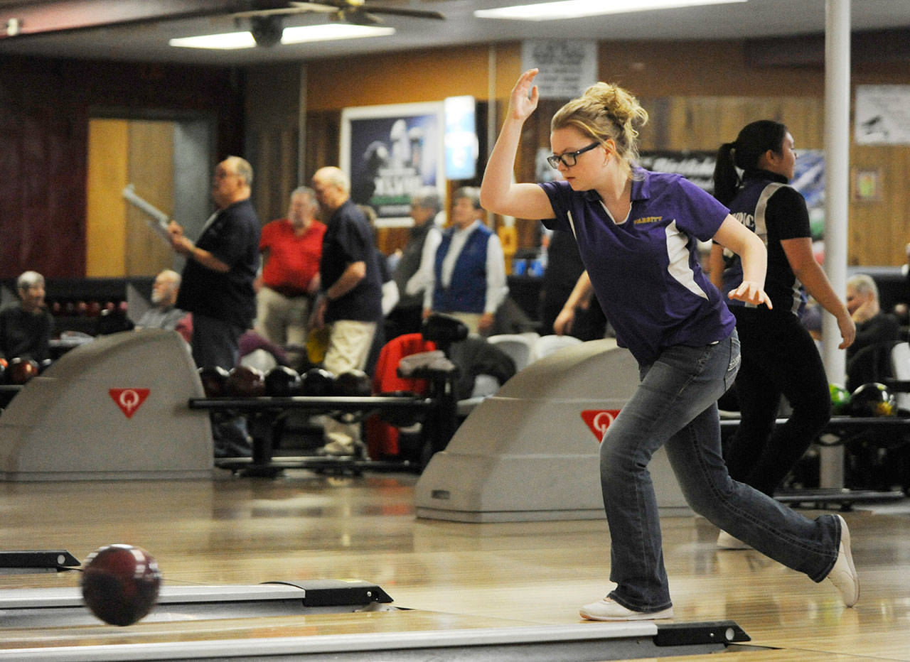 Above: Sequims Madison McKeown bowls against Olympic on Jan. 8 in a league game. McKeown bowled a series of 257 (119-138) against Olympic and 237 (97-140) two days later in the Wolves final regular season match against Bremerton  both second behind teammate Madison Murphys 267 (133-134) and 239 (126-113). The Wolves (1-10) compete at the Olympic League championships in Silverdale on Jan. 17.                                 Sequim Gazette photo by Michael Dashiell