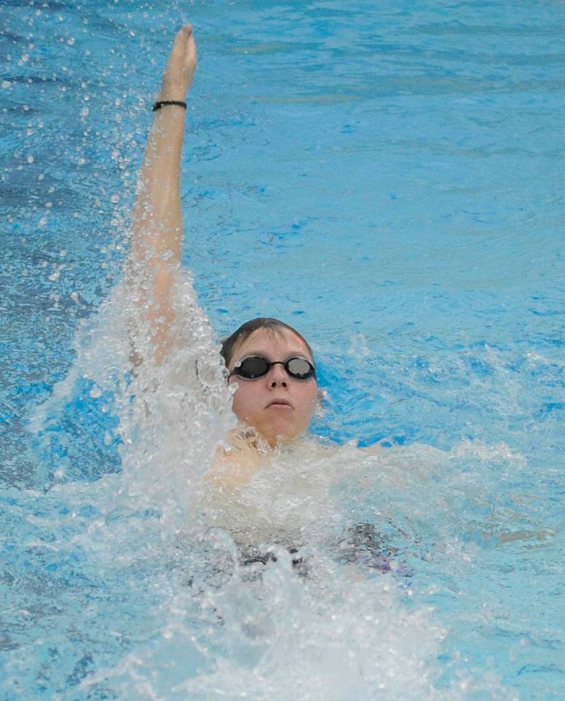 Sequims Blake Boardman swims the 100 backstroke on Jan. 10, in an Olympic League meet against North Kitsap. Sequim Gazette photo by Michael Dashiell