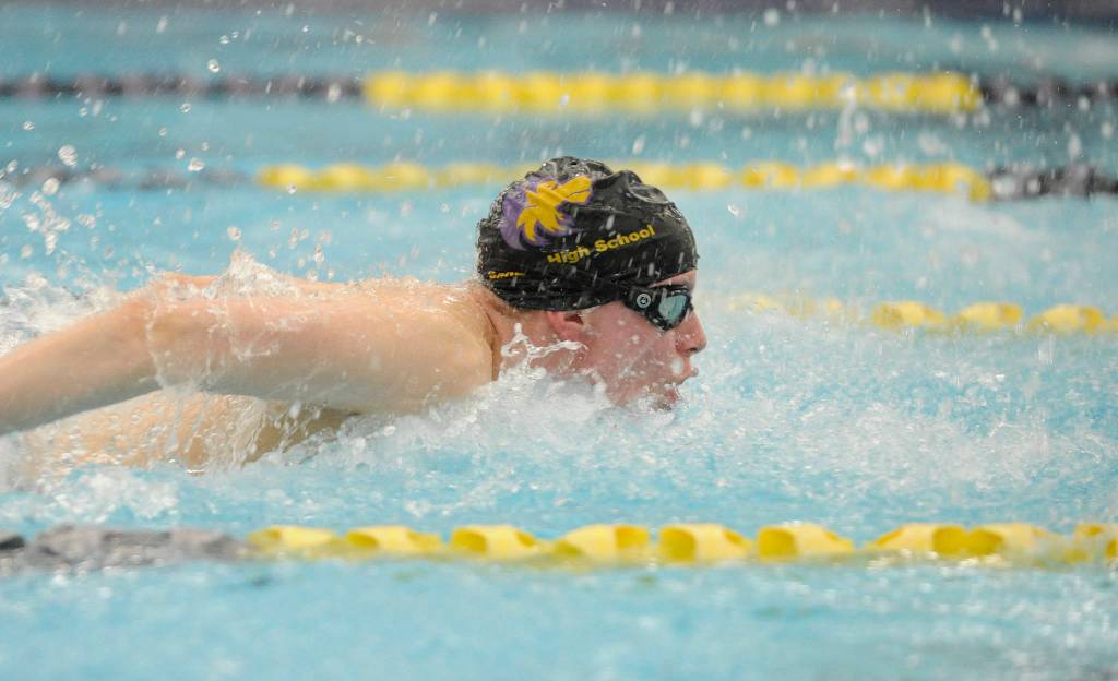 Kaleb Needoba swims the butterfly portion of the 200 medley relay as Sequim takes on North Kitsap last week. Sequim set a school and pool record with a 1:51.07 finish. Sequim Gazette photo by Michael Dashiell