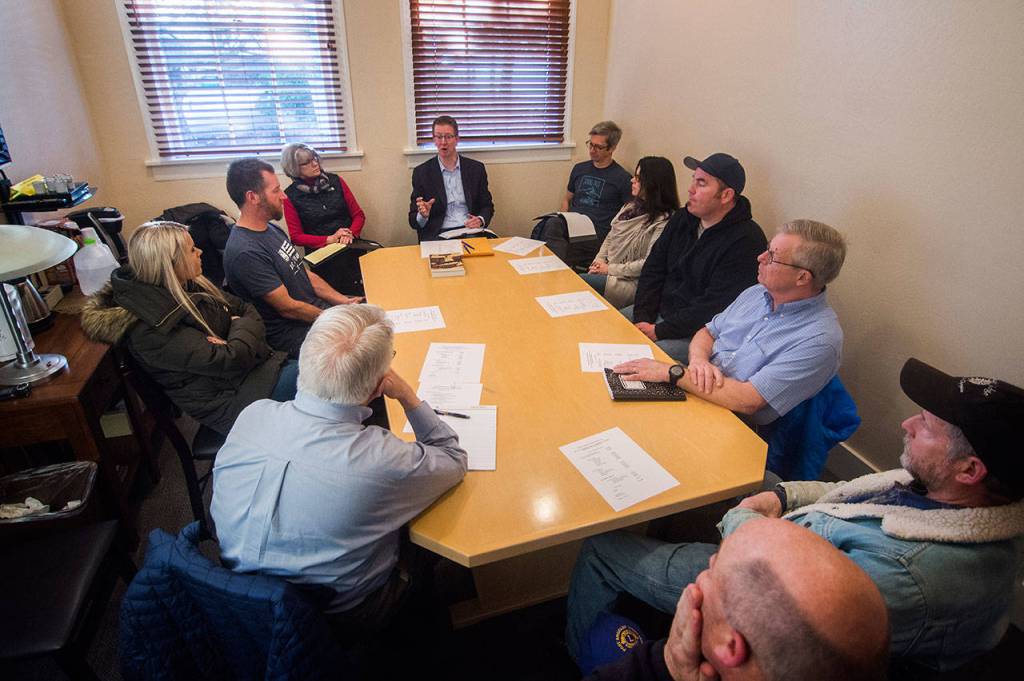 In back center, U.S. Rep. Derek Kilmer, D-Gig Harbor, meets with members of the Hurricane Ridge Winter Sports Club, which has been unable to open the Hurricane Ridge Ski and Snowboard Area due to the partial federal shutdown. Photos by Jesse Major/Peninsula Daily News
