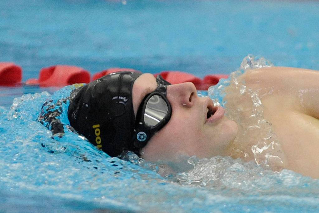 Kaleb Needoba swims the backstroke portion of the 200 individual medley against Bremerton on Jan. 24. Sequim Gazette photo by Michael Dashiell